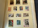 an open book with a lot of stamps on it
