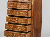 an image of a wooden chest of drawers with drawers on top of it