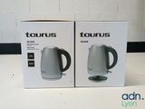 two boxes of a tea kettle sitting next to each other on a table