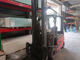 a forklift truck that is parked in a warehouse