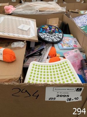 a cardboard box filled with lots of crafting supplies