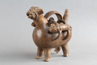 sculpture représentant un mouton portant un bébé sur son dos