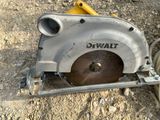 a circular saw that is sitting on the ground