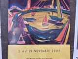 deux affiches accrochées au mur d'un immeuble, avec des bateaux dans l'eau