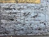a picture of a map on the side of a building