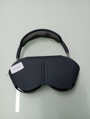 a close up of a black eye mask on a glass table
