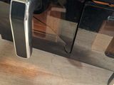 a close up of a microwave on a wooden table