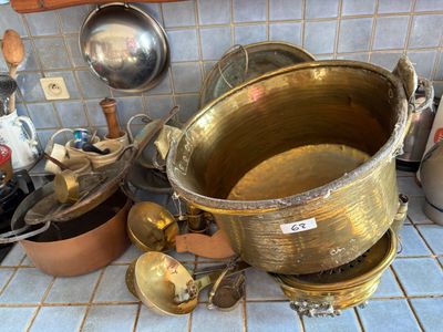 many pots and pans that are on the kitchen counter