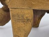 a close up of a piece of wood with writing on it