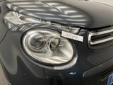 a close up of a car ' s headlight with a sticker on it