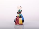 a figurine of a woman in a colorful dress