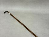 a close up of a cane on a white surface with a white background