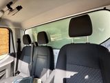 four seats in the back of a van with the sun shining through the window