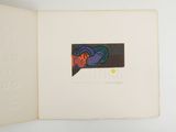 an open book with a picture of a fish on it