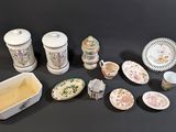 many different types of dishes and bowls on the table