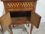 a small wooden table with a drawer on top of it