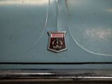 a close up of a badge on a car ' s hood