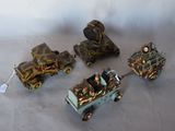 several small toy trains are lined up on a white surface