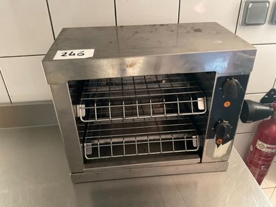 stainless steel counter top with a fire extinguisher and a fire extinguisher next to it