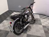 a motorcycle that is parked on a checkered floor