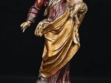 statue of jesus holding a child in his arms on a black background