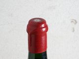 a bottle of wine that is sitting on a table