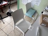 a white chair that is sitting in a room