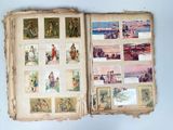 an open book with pictures of people and animals on it