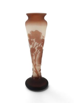a glass vase with a tree on it on a stand