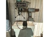 a picture of a man standing in front of a machine