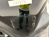 a man holding a sign on the back of a motorcycle