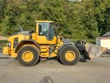 a large yellow bulldozer that is parked in the parking lot