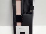an apple watch is in a box with a charger and a charger