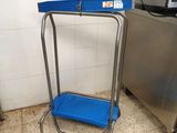 a blue step stool in the corner of a kitchen