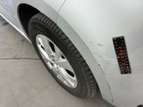 a close up of a car ' s tire with a sticker on it