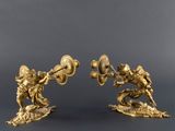 pair of antique brass figurines of two men fighting with a sword