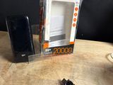 an image of a cell phone sitting on top of a table next to a charger