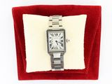 an image of a silver watch with roman numerals on a red velvet case