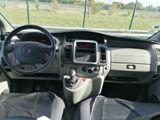the interior of a car with a steering wheel, dashboard, and dashboard controls