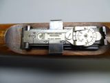 a close up view of a gun with a clock on it