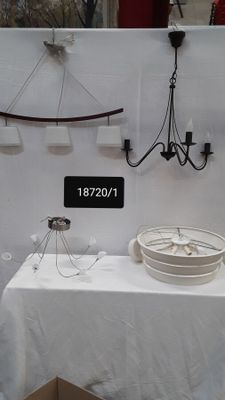 a white table with a white table cloth and a white bowl on it