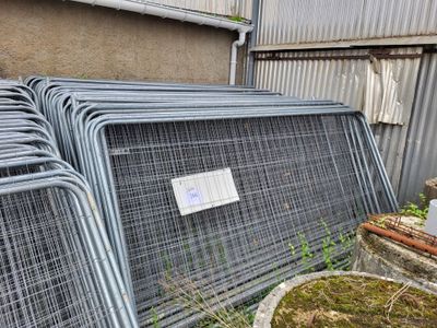 a lot of cages that are outside of a building