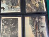 several old photos of a bridge and a river are on a table