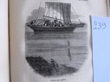 un vieux livre sur lequel figure l'image d'un bateau