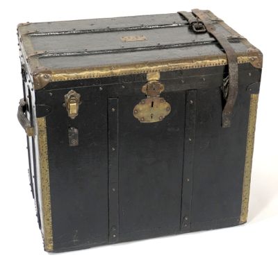 a black trunk with gold trim and a lock on it
