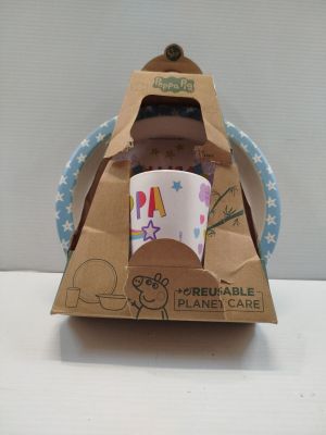 a cardboard box with a cup in it on a table