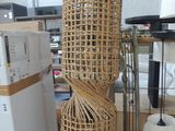a wicker lamp that is sitting on a table