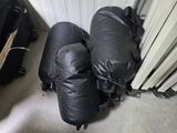 two pieces of luggage sitting on the floor next to each other