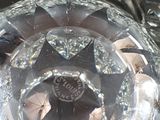 a close up view of a glass vase with a star design on it