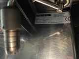 a close up of a metal object with a label on it